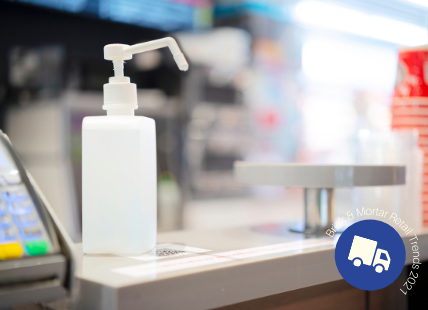 Hand sanitizer on checkout counter at store
